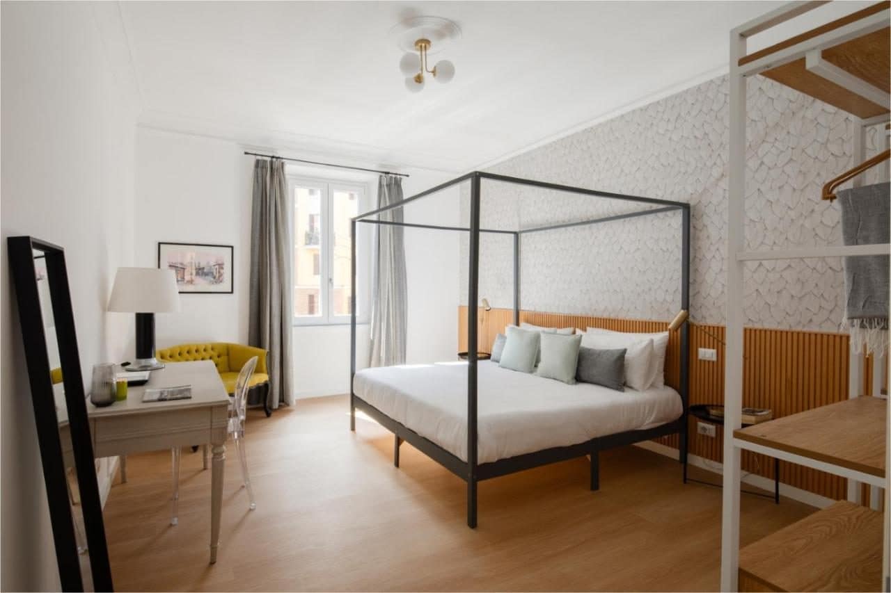 Une chambre à lit à baldaquin. © Aeterna Suites Roma