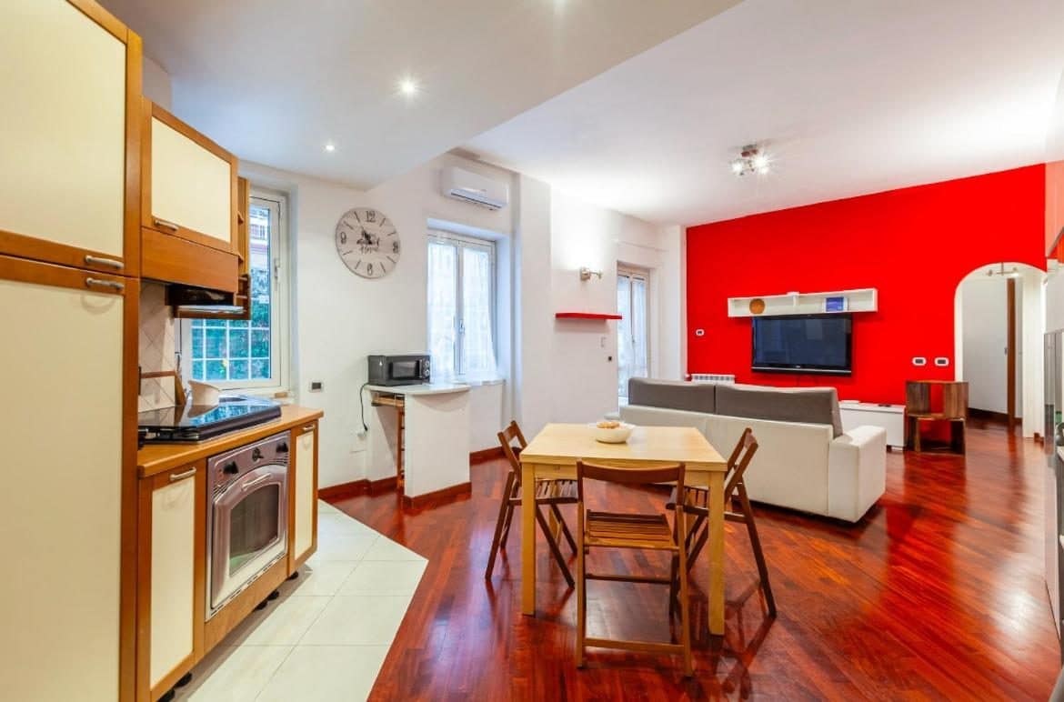 Le séjour et le coin cuisine. © Vacanze Romane con giardino